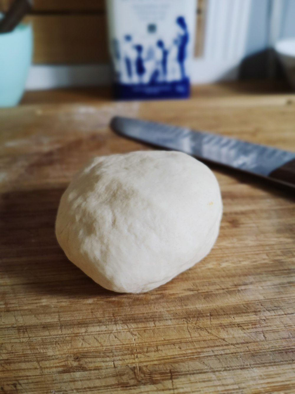 white dough on brown wooden table