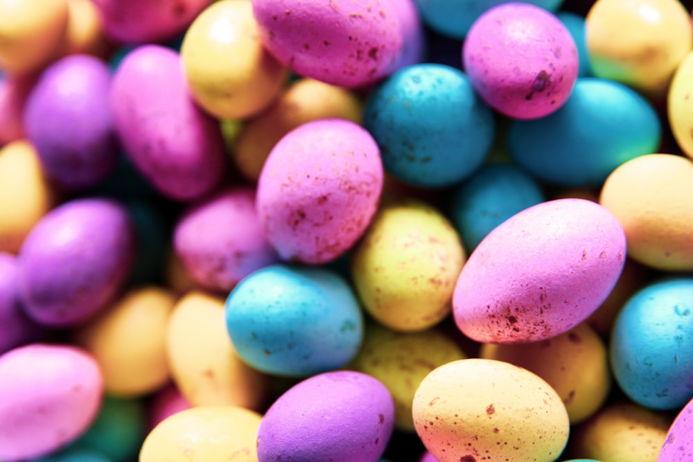 pink yellow and blue round candies