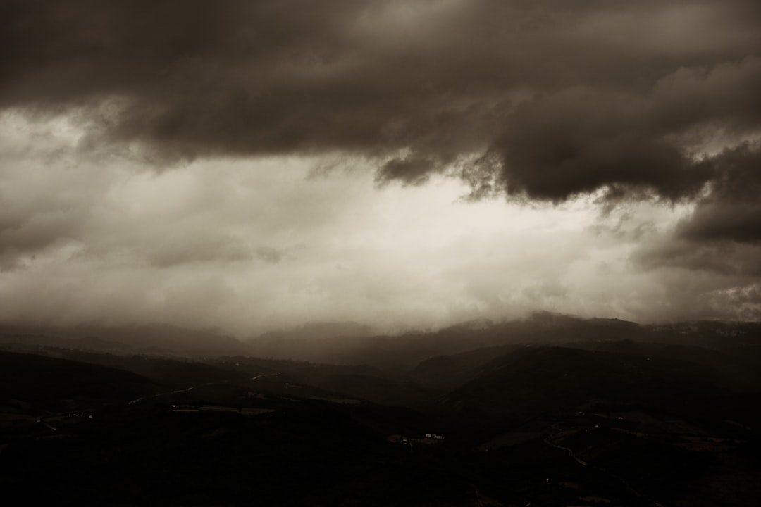 black mountains under white clouds