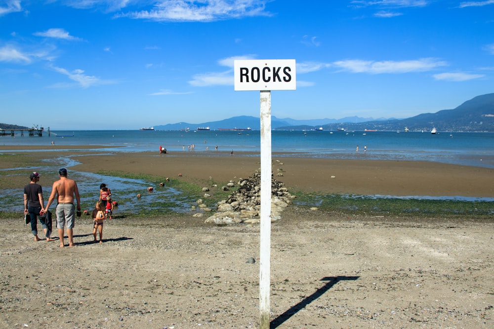 person walking on beach during daytime