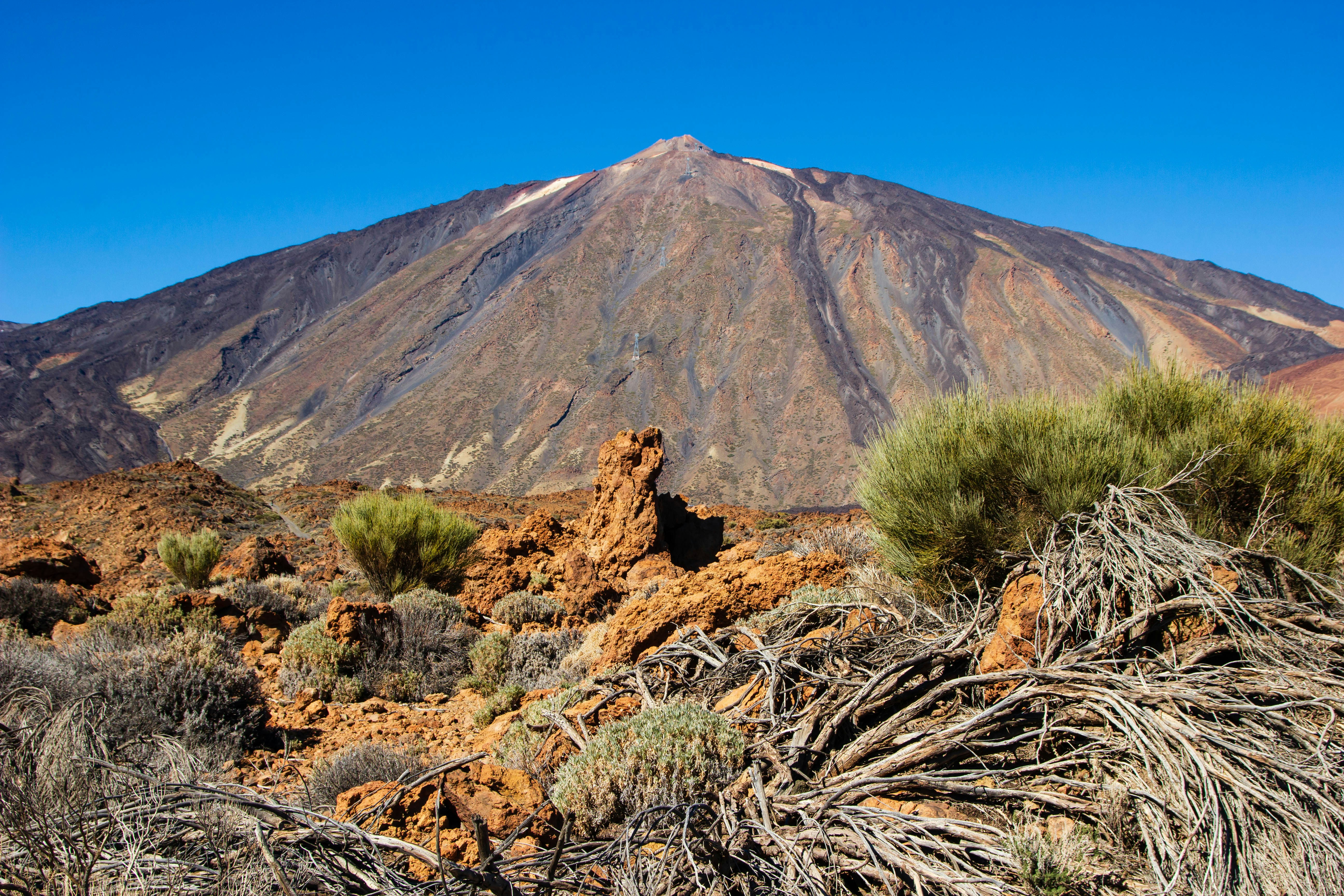 brown mountain under blue sky during daytime