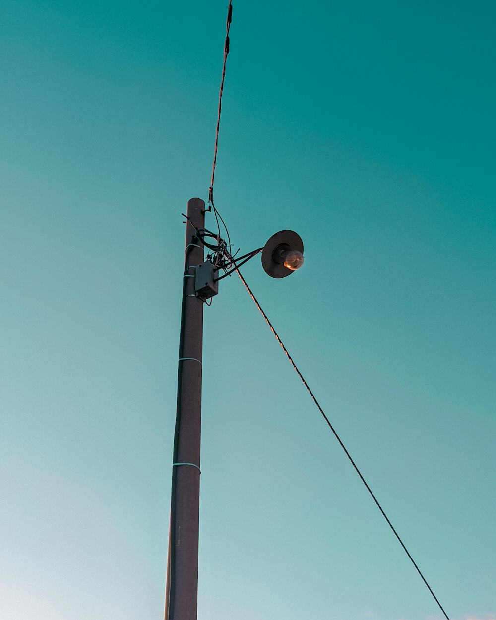 black street light under blue sky during daytime
