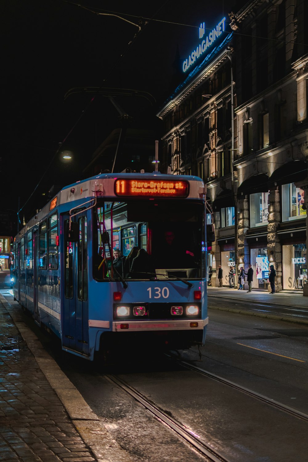 red and white tram on road during daytime