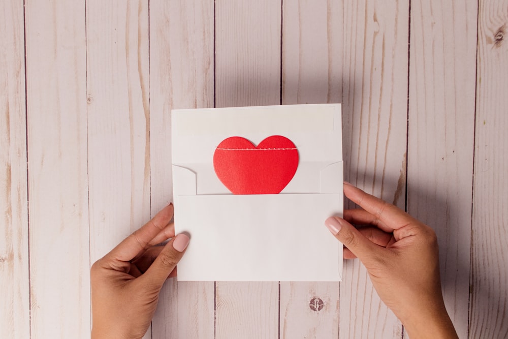 white and red heart print card