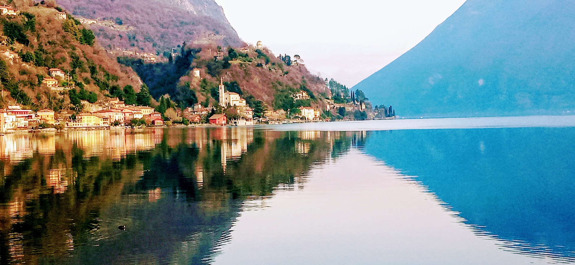 woman wearing yellow long-sleeved dress under white clouds and blue sky during daytime