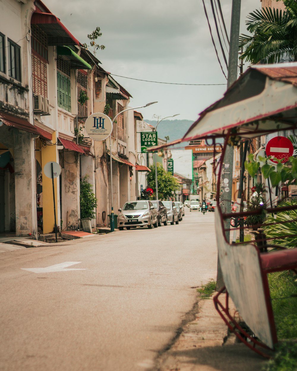 cars parked beside the road during daytime