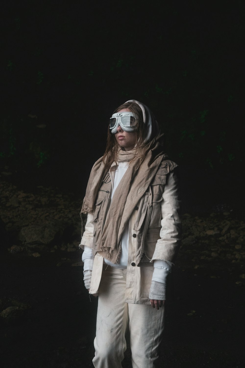 woman in brown jacket and white pants wearing sunglasses