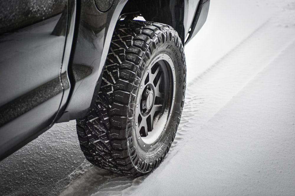 grayscale photo of car wheel