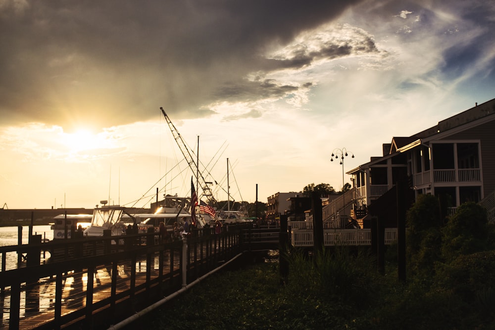 brown wooden bridge near buildings during daytime