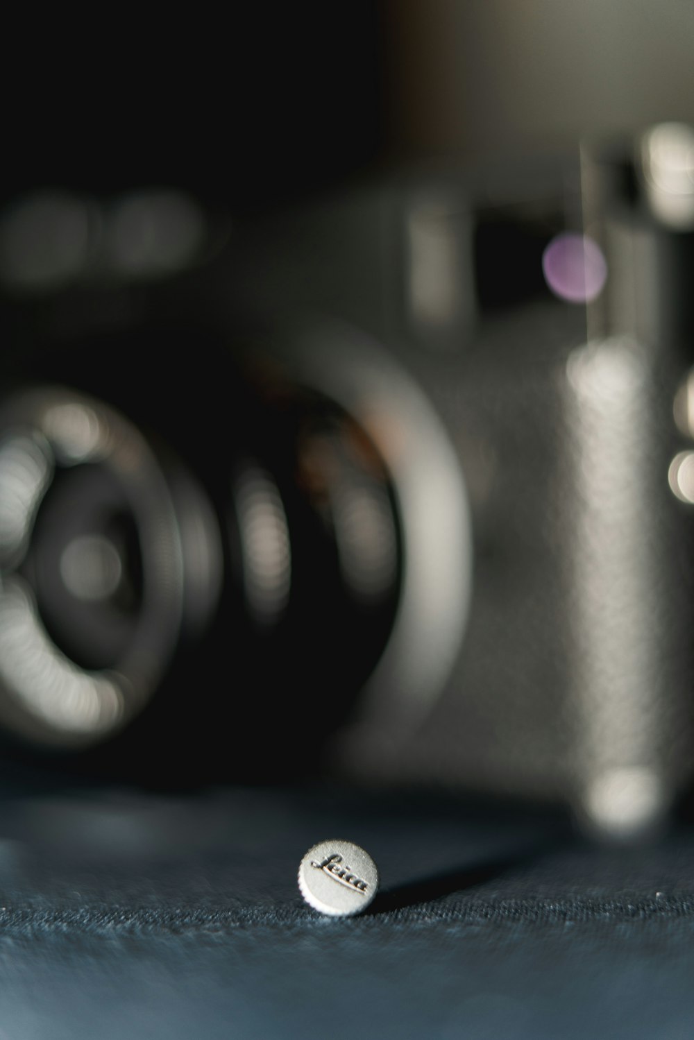 black camera lens on blue textile