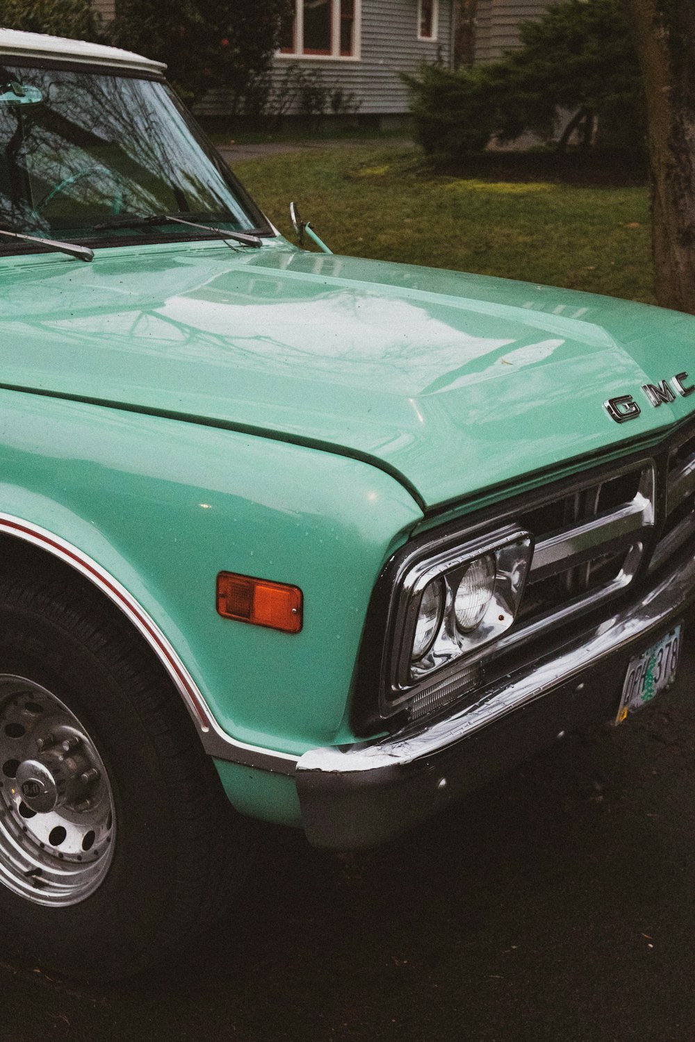 green and white chevrolet car