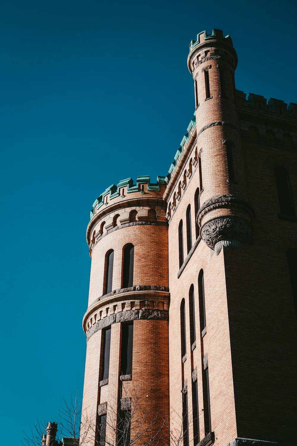 brown concrete building under blue sky during daytime