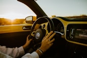 person driving car during daytime