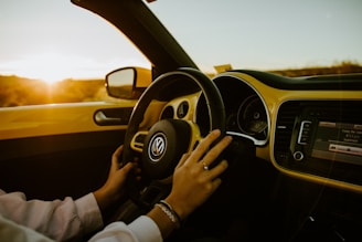 person driving car during daytime