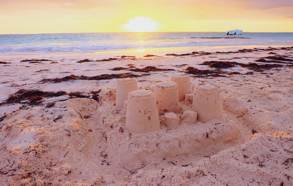 white rock formation on seashore during sunset