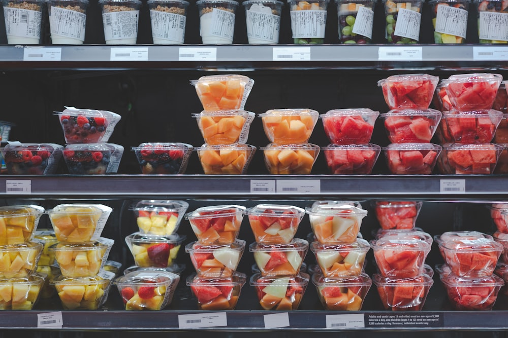 assorted fruits in plastic containers