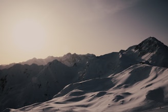 snow covered mountain during daytime