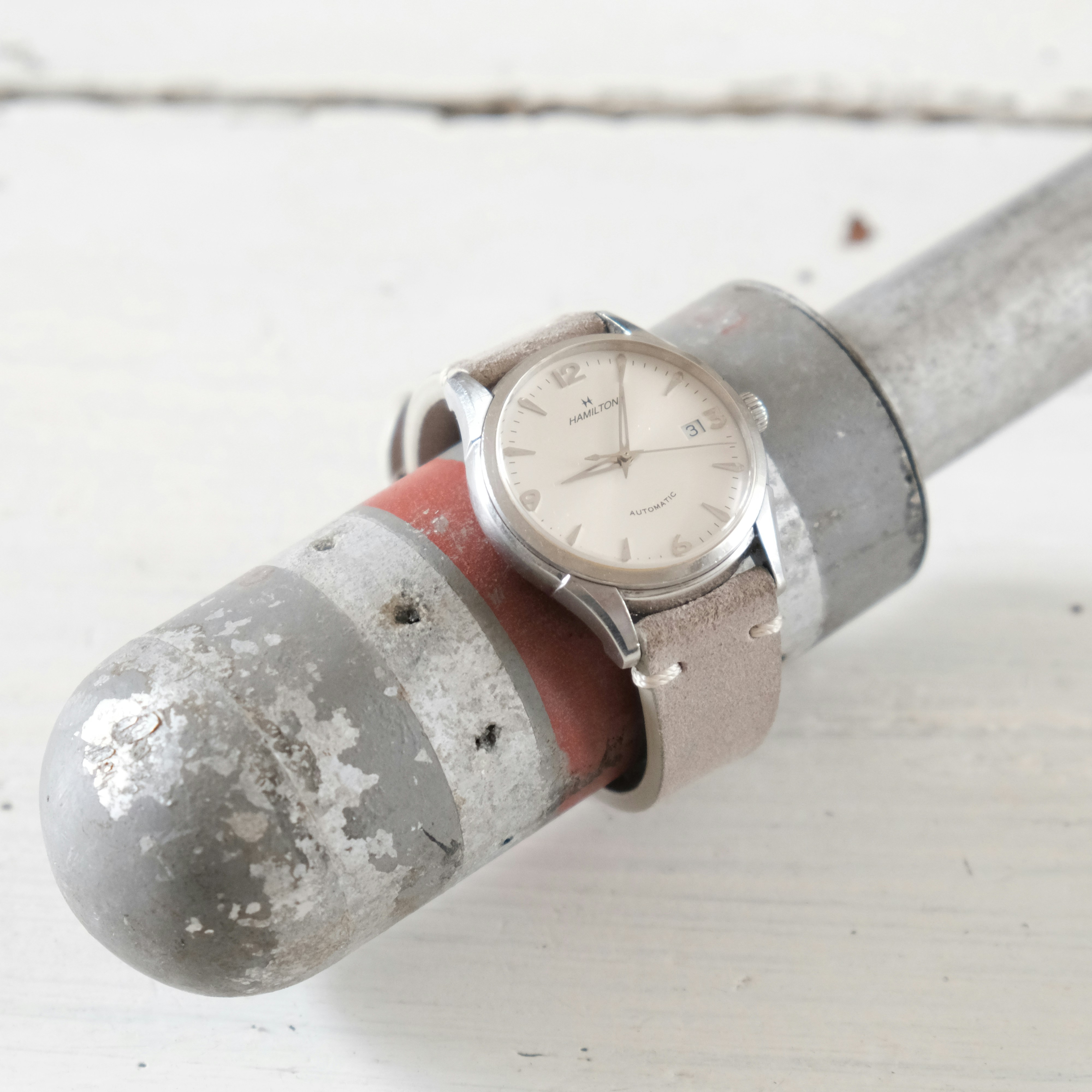 silver and red steel pipe