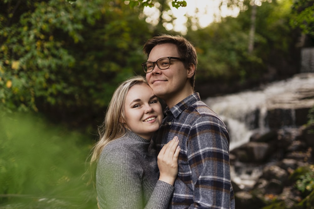 man and woman smiling and hugging each other