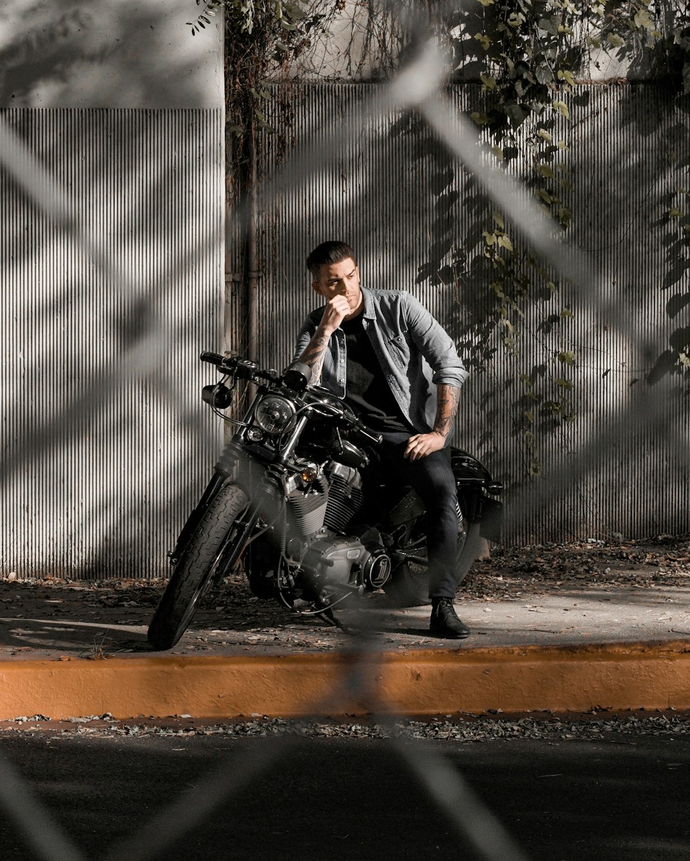 man in gray dress shirt riding black motorcycle