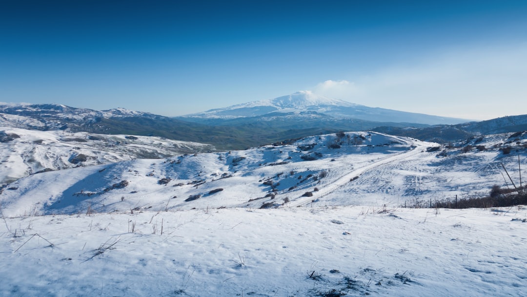 snow covered mountain under blue sky during daytime