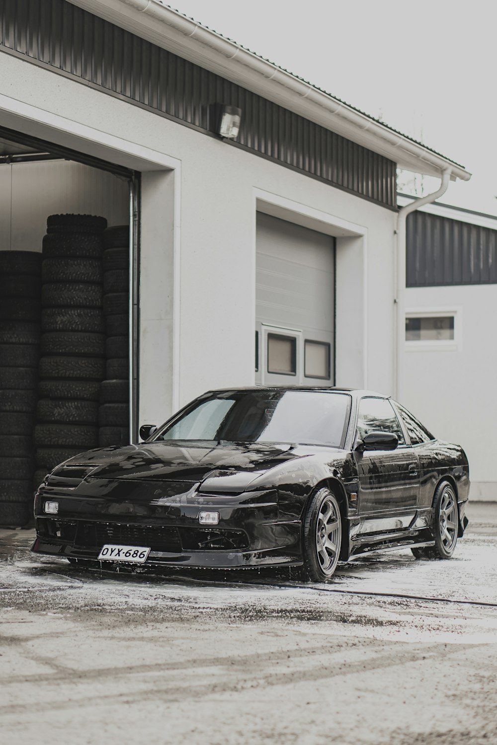 black bmw m 3 parked in front of white building