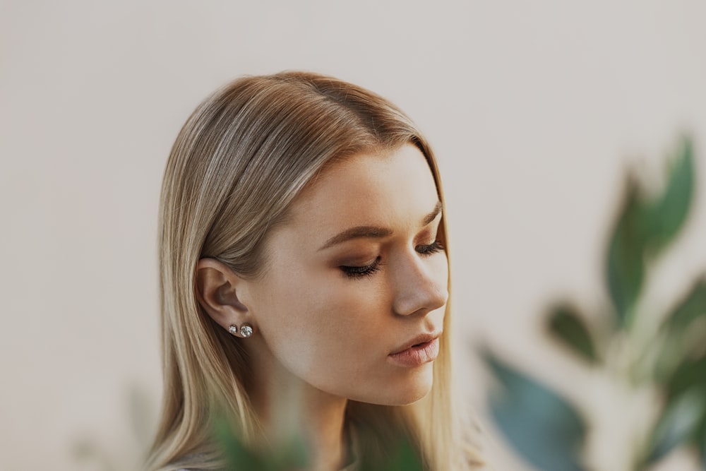 woman with blonde hair looking down