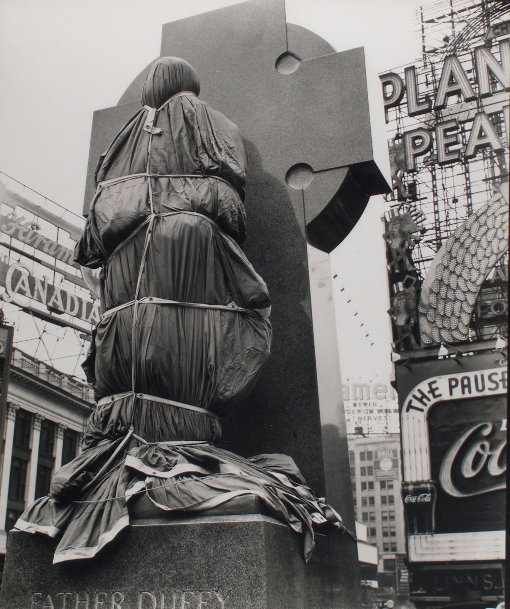 grayscale photo of Father Duffy statue in Times Square