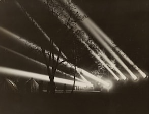 Strong white beam illuminating the sky in search for drones and enemy vehicles