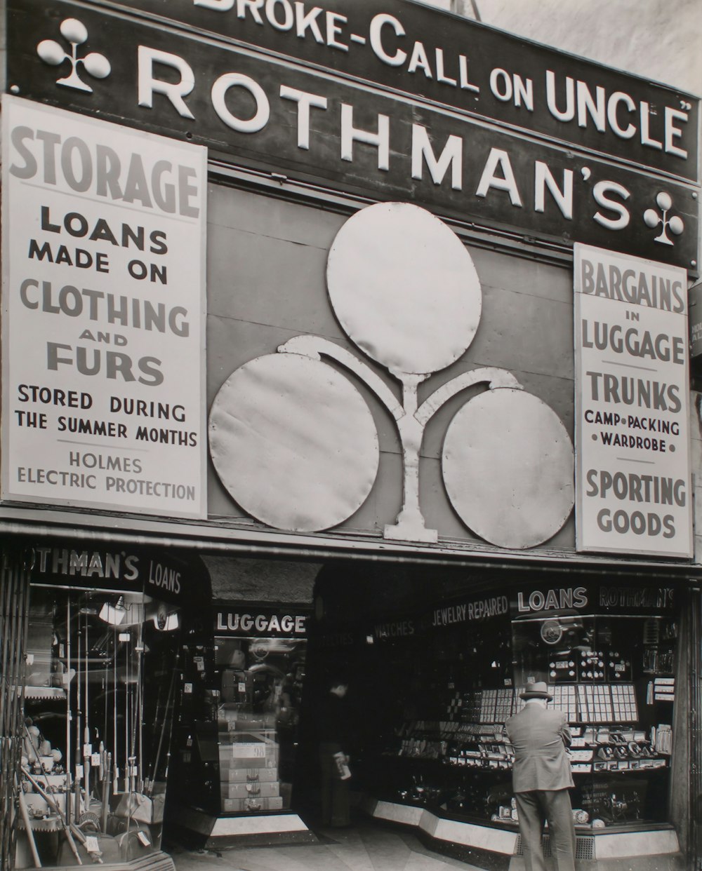 white and black photo of pawn shop front window