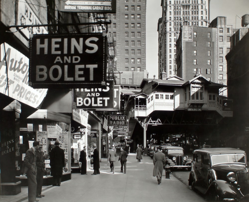 grayscale photo of people walking on street