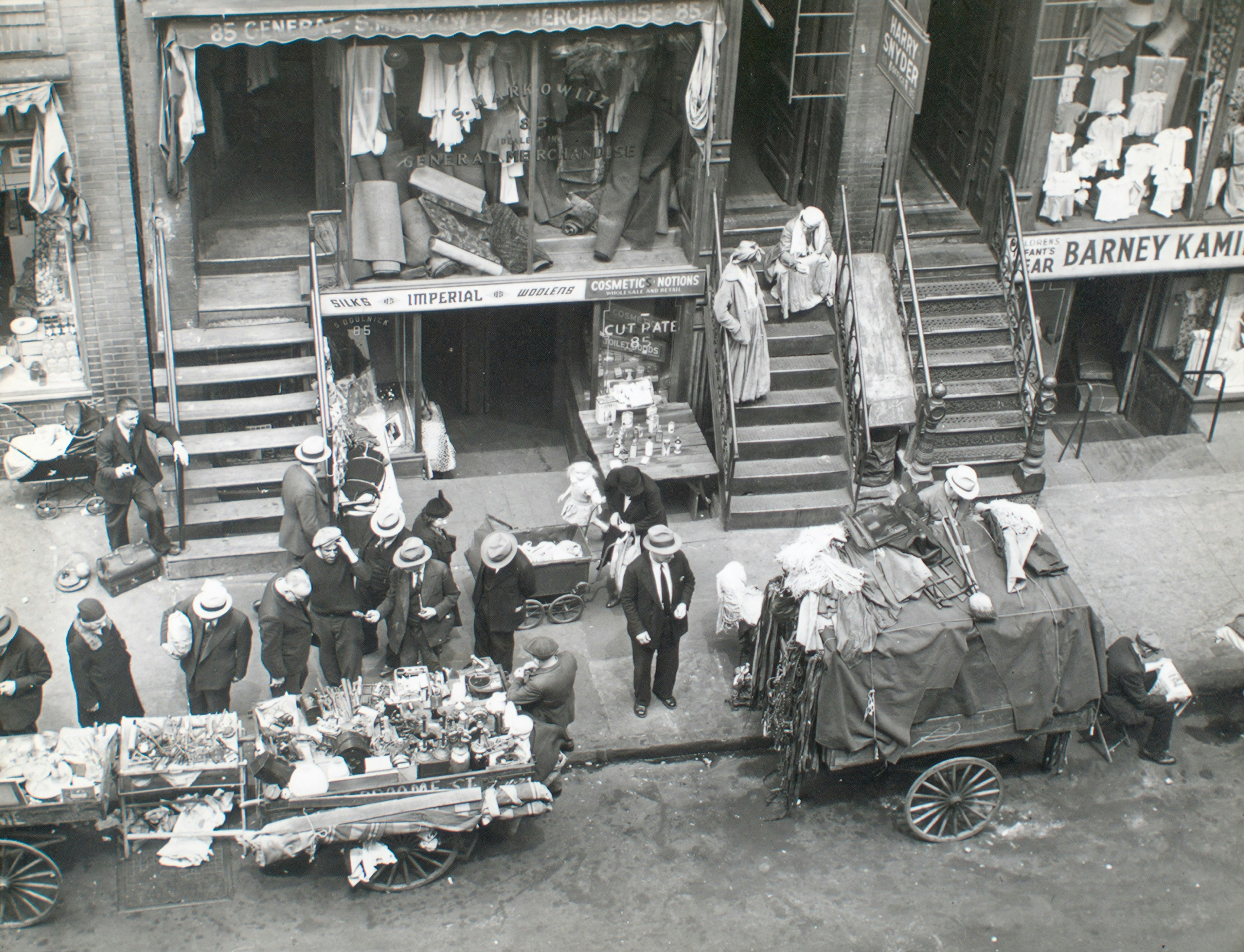 grayscale photo of people in front of car