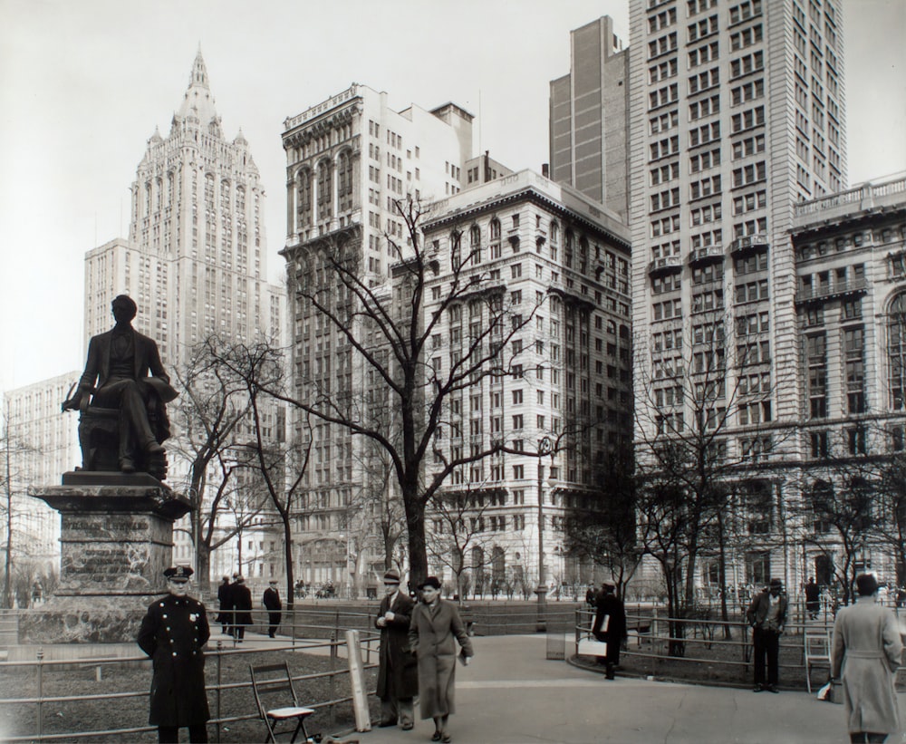 people walking on street near high rise buildings during daytime