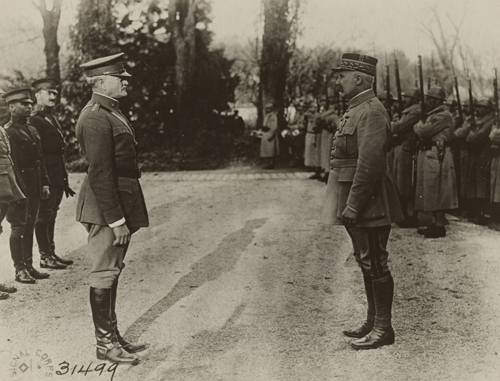 grayscale photo of 2 men in military uniform 