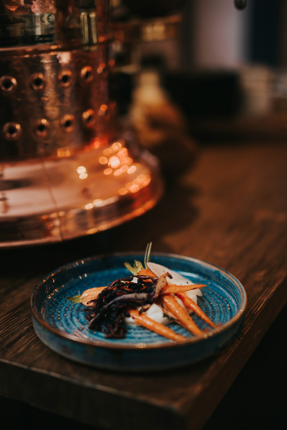 brown sticks on blue glass bowl