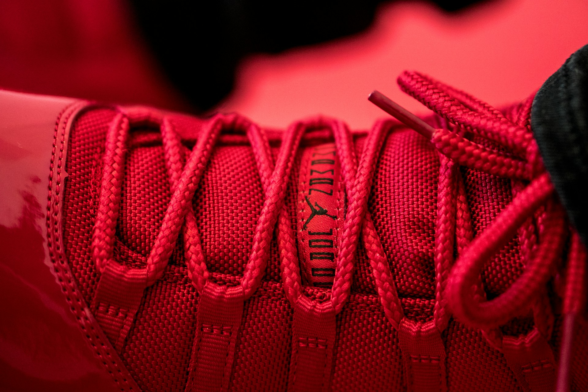 Close-up of a Lace Lock Pro device securely holding a sneaker's laces tight.