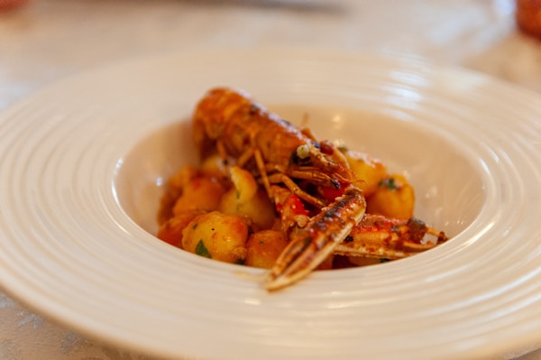 Cooked shrimp on white ceramic plate