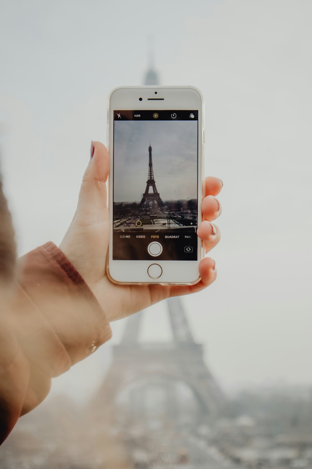 person holding silver iphone 6