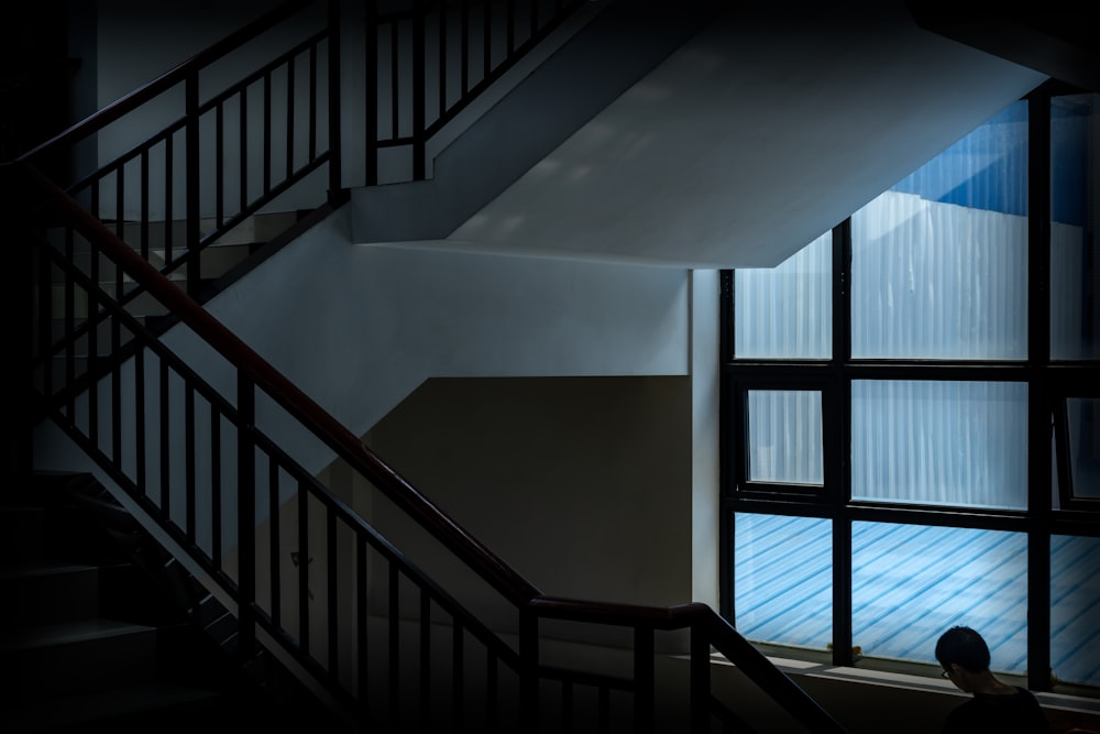 white concrete staircase with black metal railings