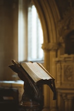 A thoughtful philosopher speaking to a small group in a cozy study filled with ancient texts.