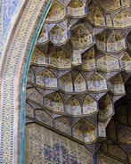 Workers carefully inspecting tile quality in the Tabriz factory.