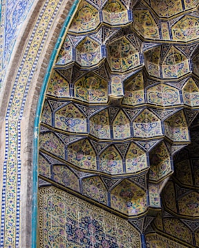 Workers carefully inspecting tile quality in the Tabriz factory.