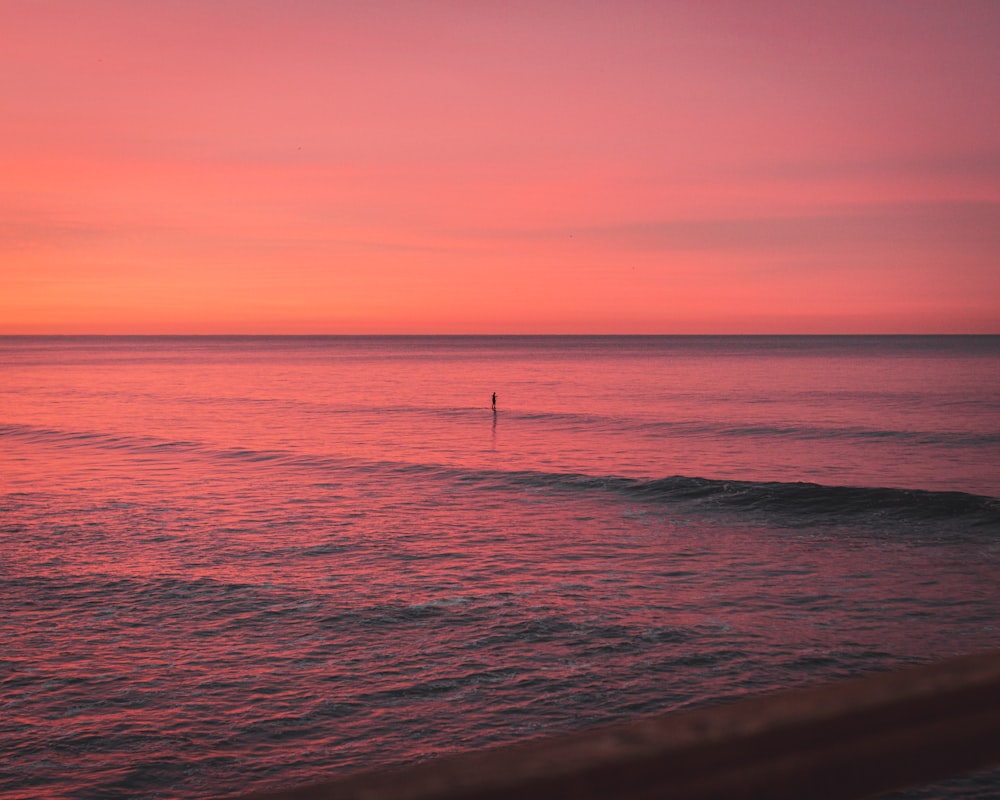 body of water during sunset