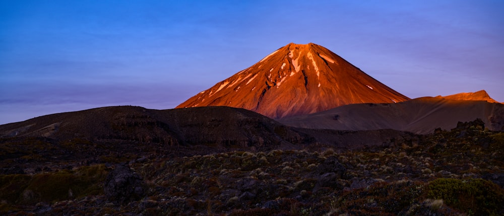 brown mountain under blue sky during daytime