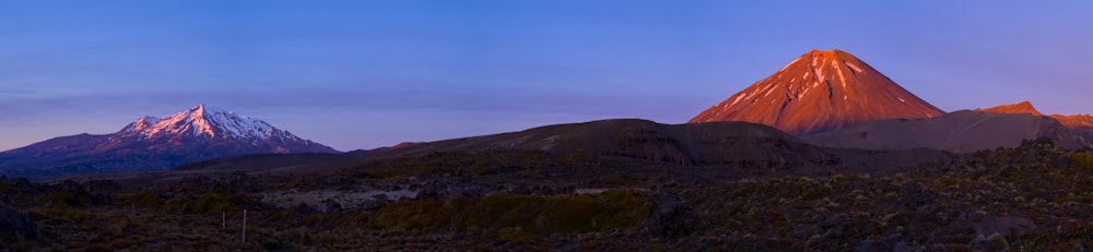 a group of mountains with a sky background