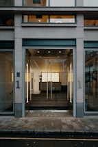 A modern office building entrance with a welcoming reception desk.