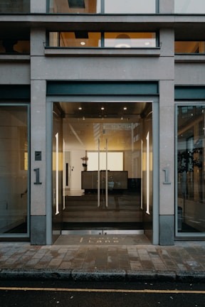 A sleek modern glass door entrance to a commercial building.