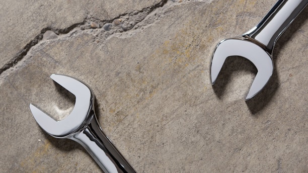 stainless steel tool on gray sand