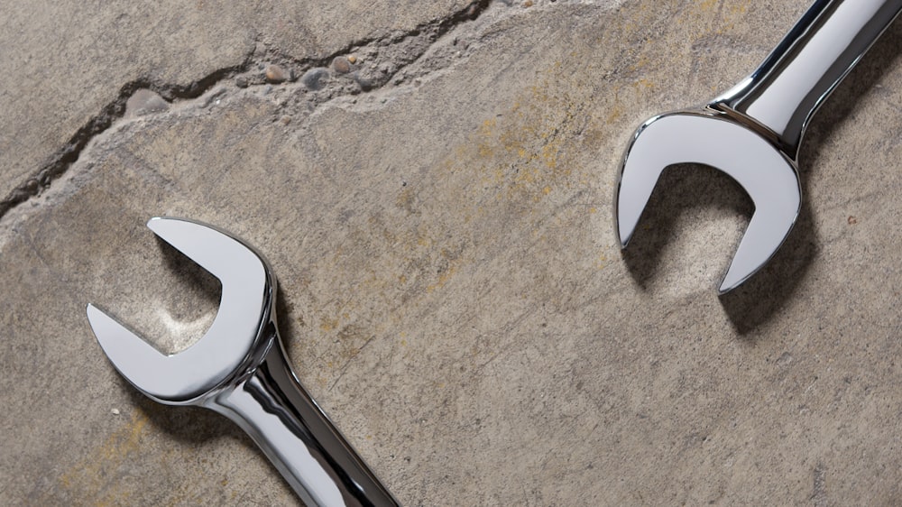 stainless steel tool on gray sand