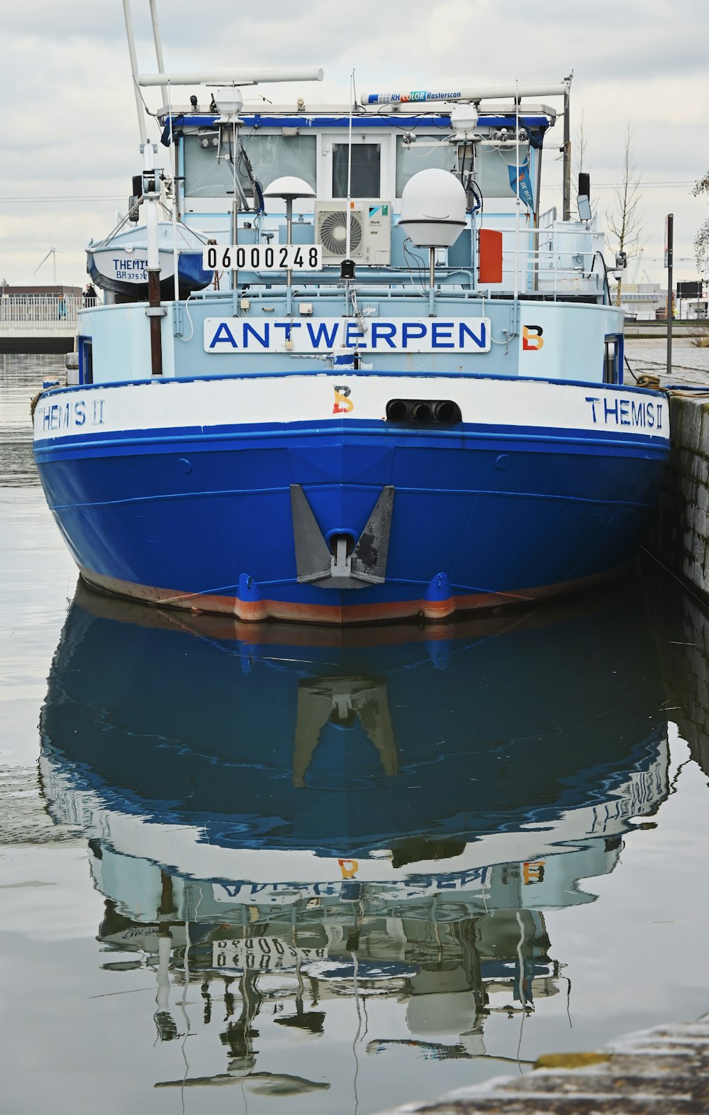 blue and white boat on water during daytime